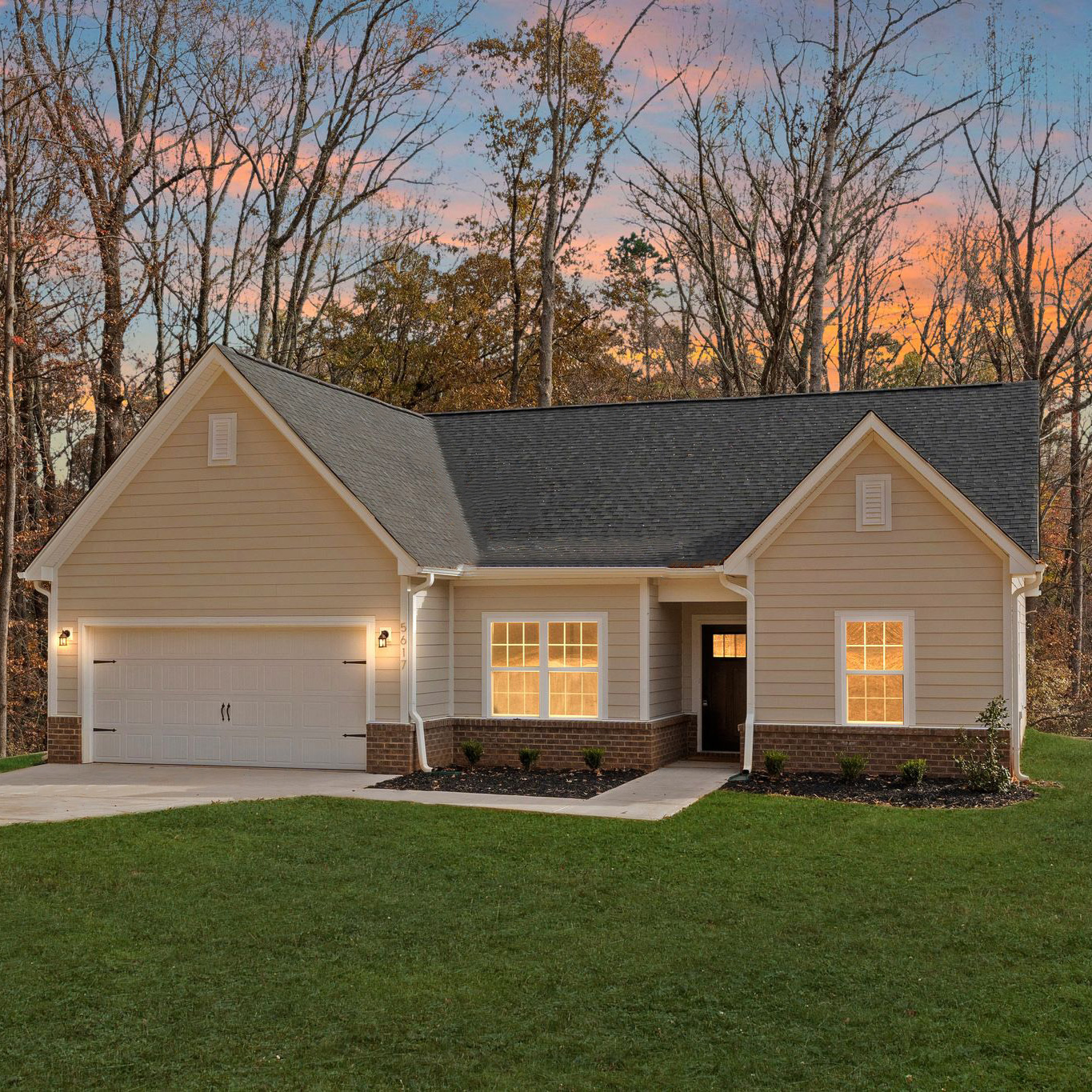 Northway Homes house at twilight with lights turned on